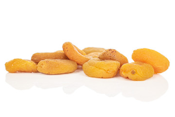 Lot of whole dried orange apricot isolated on white background