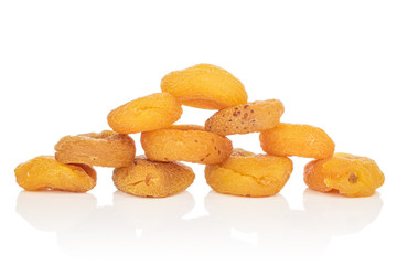 Group of ten whole dried orange apricot pyramid isolated on white background