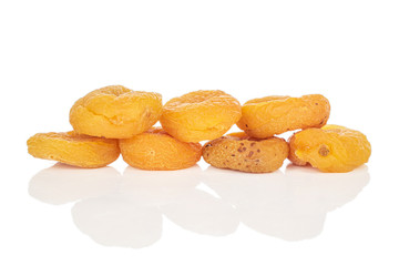 Group of seven whole dried orange apricot isolated on white background