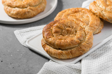 Buns on a wooden Board Board on a light gray kitchen table	