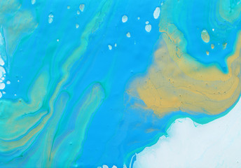art photography of abstract marbleized effect background. blue, mint and gold creative colors. Beautiful paint