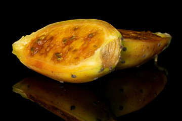 Group of two halves of prickly green opuntia isolated on black glass