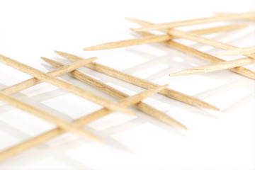 Lot of whole light wooden brown toothpick isolated on white background