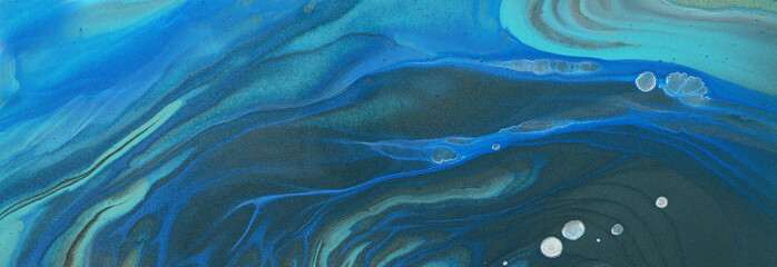 art photography of abstract marbleized effect background. blue, turquoise and black creative...