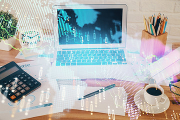 Financial market graph hologram and personal computer on background. Multi exposure. Concept of...