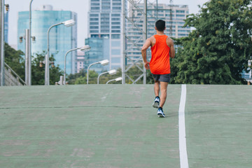 runner on the street be running for exercise; sport, people, exercising and lifestyle concept