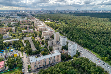 Fototapeta na wymiar Big city, aerial view. The microdistrict of a big city, residential buildings with many high-rise buildings.