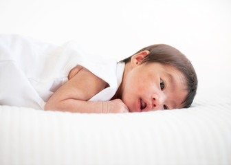 newborn baby sleep in bed on white background