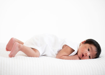 newborn baby sleep in bed on white background