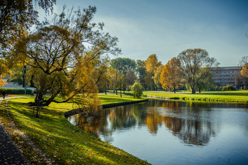 Beautiful autumn scene of Maras Pond in Riga. Autumn cityscape with soft sunlight. Agenskalsns district. Latvia.