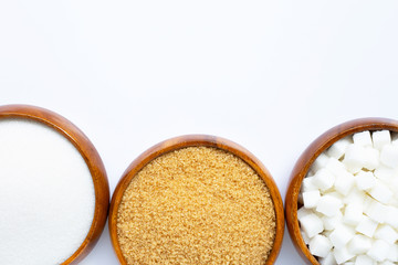 Wooden bowl with sugar on white background.