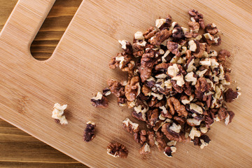 Walnut kernel in a white bowl