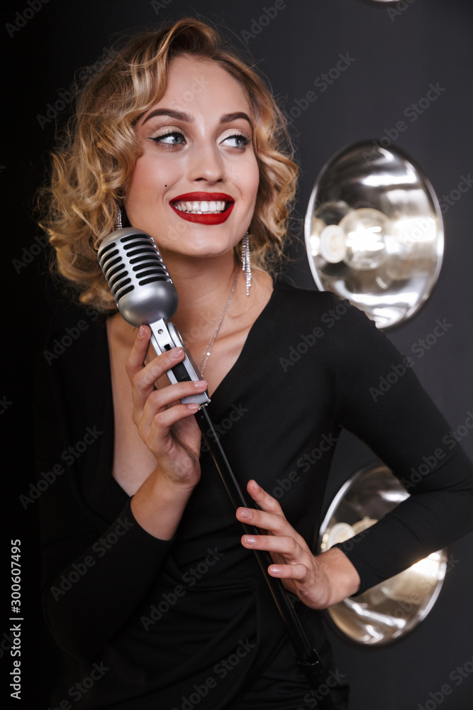 Poster image of caucasian vocalist woman in elegant dress singing into microphone