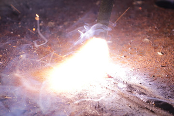 Welding metal macro background. Industrial welding light sparks.