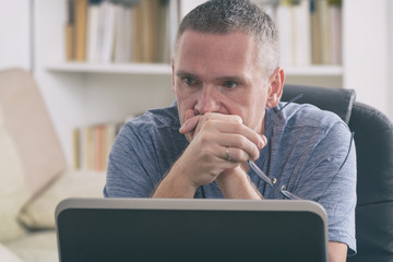 Tired and overworked freelancer at his working place