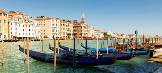 Panorama of Grand canal with boats and gondolas on sunny summer day in Venice. Italy