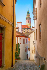 Fototapeta na wymiar Cesky Krumlov cozy street with a tower. Small medieval town in Czech Republic