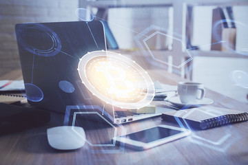 Multi exposure of blockchain theme hologram and table with computer background. Concept of bitcoin...