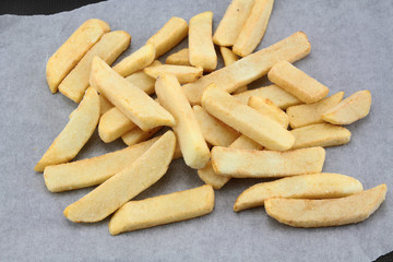 frozen raw fries on a baking sheet