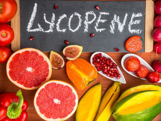 Fruits and vegetables containing lycopene. Healthy vegan food background. Lycopene is a red...