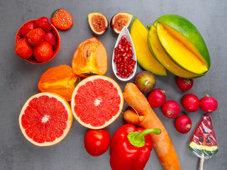 Close up of bright red, orange healthy fruits and vegetables products for Immunity boosting, rich in vitamins and antioxidants, carotenoid, lutein, phosphorus, calcium, Healthy eating concept