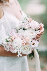 Printing and decor for a wedding with flowers. Modern Bridal bouquet in hand.