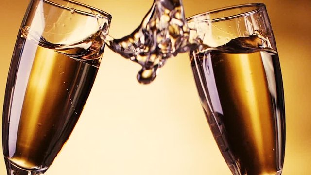 Slow Motion of having a toast with two champagne glasses. HD.