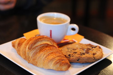 Breakfast of coffee, cookie and croissant 
