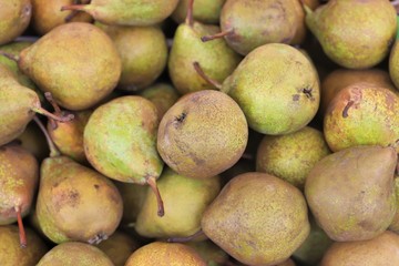 close up of pears on display at the market