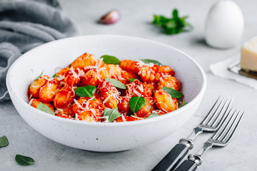 Traditional Italian potato Gnocchi with tomato sauce, parmesan cheese and fresh basil