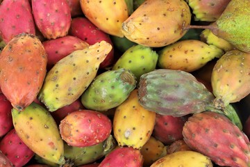 close up of prickly pears on display at the market