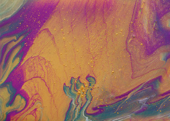 Naklejka premium art photography of abstract marbleized effect background. pink, purple, gold and blue creative colors. Beautiful paint.