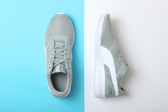 men's sneakers on a colored background top view. men's footwear. minimalism