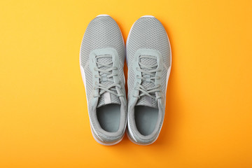men's sneakers on a colored background top view. men's footwear. minimalism