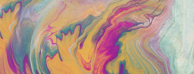 art photography of abstract marbleized effect background. pink, purple, gold and blue creative colors. Beautiful paint.