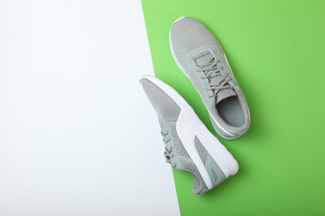 men's sneakers on a colored background top view. men's footwear. minimalism