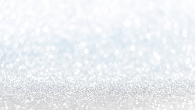 Abstract glittering silver glitter light can be used for wedding background, Christmas and New Year's background with champagne bokeh, with copy space for text.