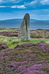 The Ring of Brodgar, a Neolithic henge and stone circle on the largest of the Orkney islands,...