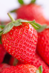 Beautiful and delicious strawberries in a wooden box basket, concept of organic farming, fresh direct delivery from orchard, close up.