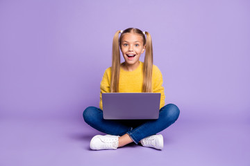 Full size photo of amazed child sit folded crossed legs work computer get social media notification...
