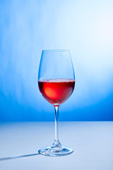 cocktail Aperol Spritz in glass on blue background with copy space