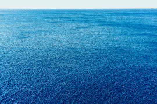 Blue sea surface with waves aerial view