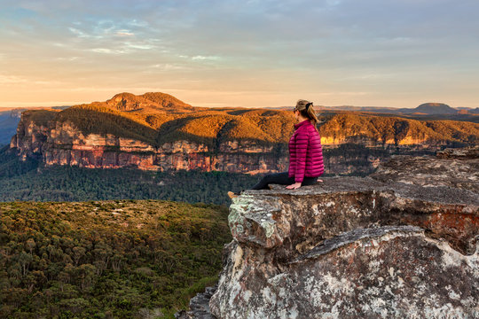 Woman taking in early morning mountain views