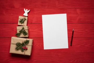 Christmas or New Year presents on red wooden planks