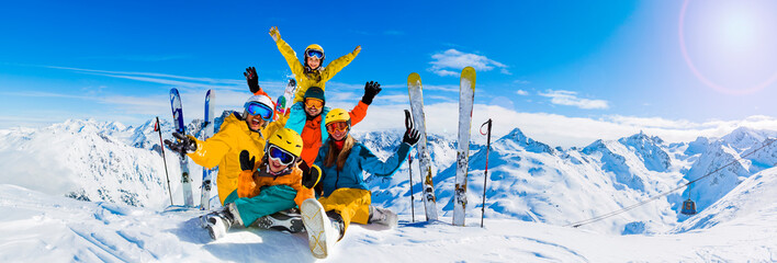 Happy family enjoying winter vacations in mountains, Val Thorens, 3 Valleys, France. Playing with...