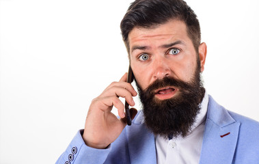 Handsome man talking at cell phone. Surprised businessman calling with telephone. Businessman talking on mobile phone. Bearded businessman speak on phone. Emotional businessman talking on smart phone.