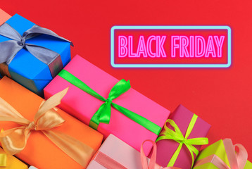 Different colored gift box on color background. Top view of various present boxes on minimal...