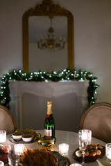 Calm image of interior modern home living room decorated christmas tree and gifts, sofa, table covered with blanket