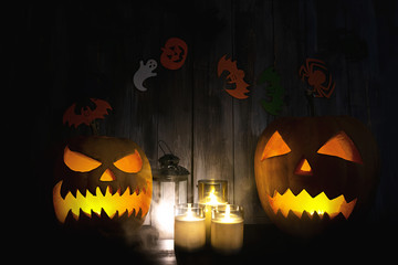 Halloween background with pumpkin head lantern and candles. Halloween pumpkin Jack-o-Lantern