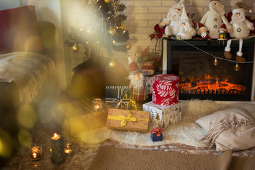 Living room of the house with Christmas decorations and gifts under the Christmas tree.
